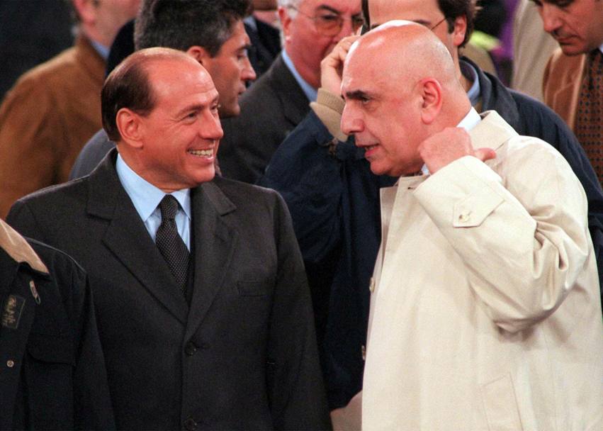 30 aprile 1998 Silvio Berlusconi in compagnia di Adriano Galliani al loro arrivo sulle tribune d&#39;onore dello stadio Olimpico prima dell&#39;inizio della partita di ritorno della finale di Coppa Italia. La Lazio ha conquistato la Coppa Italia, dopo 40 anni, imponendosi sul Milan per 3 reti a 1. ANSA/MP